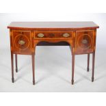 A George III mahogany and satinwood banded bow front sideboard, the shaped top above a central