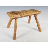 A 19th century Provincial elm stool, the rectangular top on four splayed supports, 36cm wide x