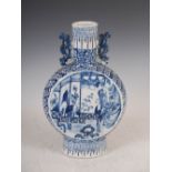 A Chinese porcelain blue and white pilgrim vase, Qing Dynasty, the circular panels painted with
