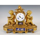 A late 19th century French ormolu and porcelain mounted mantel clock, THLE. MARTIN, PARIS, the