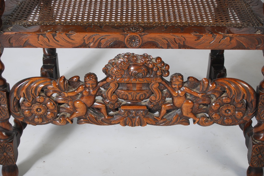 A pair of late 19th century Carolean style carved walnut armchairs, the top rails carved and pierced - Image 3 of 6