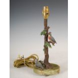 A late 19th/early 20th century cold painted bronze kingfisher table lamp, modelled as a flowering