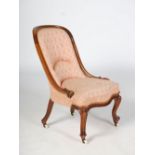 A Victorian walnut parlour chair, the upholstered back and serpentine seat raised on scroll carved