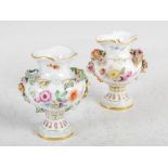 A pair of Meissen porcelain floral encrusted miniature urns, blue crossed swords marks, 9.5cm high