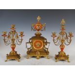A late 19th century French gilt metal clock garniture retailed by Aird & Thomson, Glasgow, the