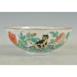 A Chinese porcelain famille rose bowl, Qing Dynasty, decorated with cat, peony, butterfly and