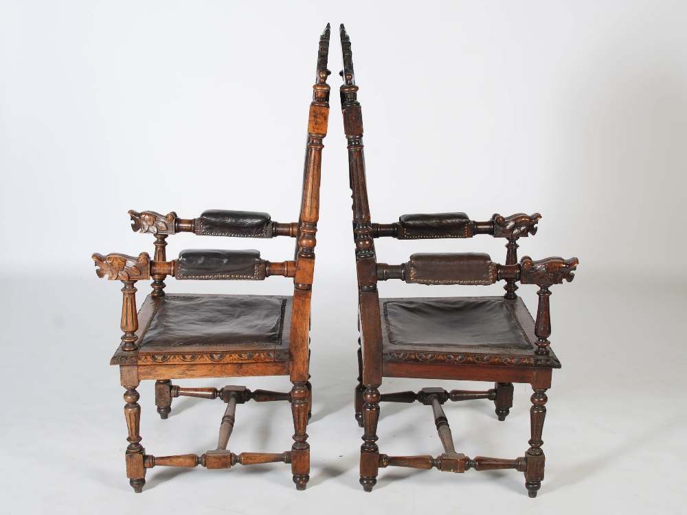 A pair of late Victorian oak armchairs, the top rails carved with shields flanked by lions above - Image 3 of 4