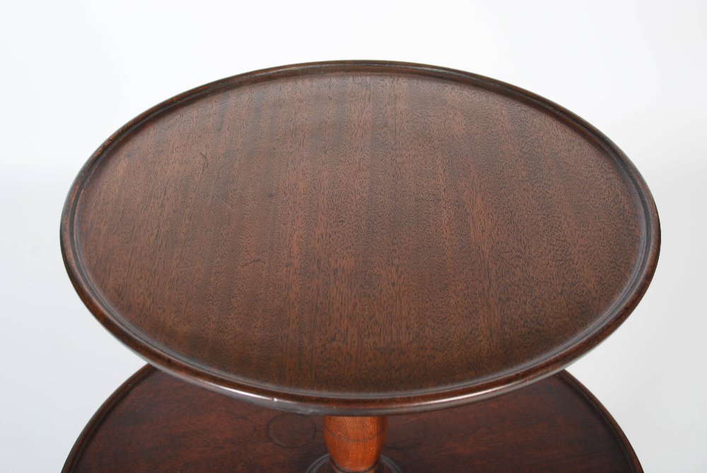 A George III mahogany three tier revolving dumb waiter, the graduated revolving stand supported on - Image 2 of 6