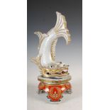 A Japanese Imari porcelain model of a mythical fish, late 19th/early 20th century, raised on three
