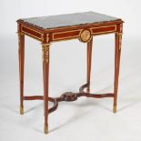 A late 19th/early 20th century French Empire style mahogany and gilt metal mounted side table, the