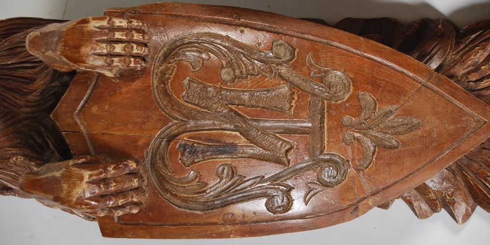 A pair of late 19th century carved pine brackets, carved with lions supporting shields carved with - Image 5 of 7