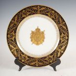 A Sevres Empire style Napoleonic interest dessert plate, decorated with Napoleonic crest in a cobalt