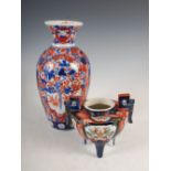 A Japanese Imari porcelain vase, late 19th/early 20th century, decorated with panels of flowers