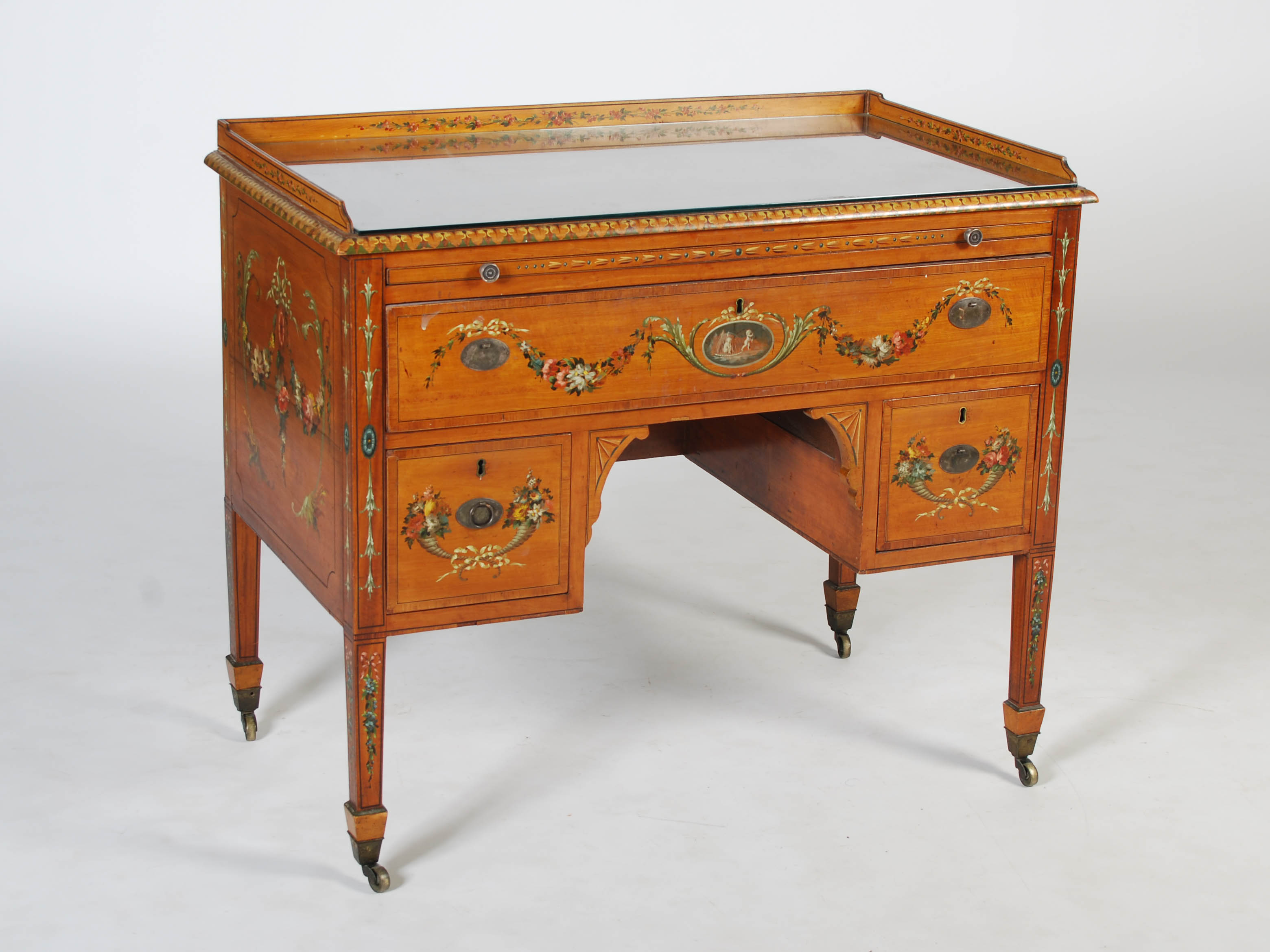 A 19th century painted satinwood wash stand, the rectangular top with three quarter gallery above