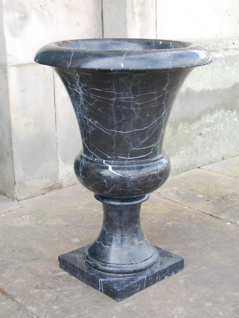 A pair of 20th century black and white veined marble urns, formed in two sections, resting on square - Image 2 of 5