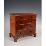 A late 19th/ early 20th century George III style mahogany apprentice chest, fitted with two short