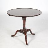 A George III mahogany bird cage tripod table, the hinged circular top with a slightly raised
