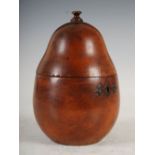 A fruitwood tea caddy in the form of a pear, the hinged cover with a turned finial, 15.5cm high