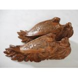 A pair of late 19th century carved pine brackets, carved with lions supporting shields carved with