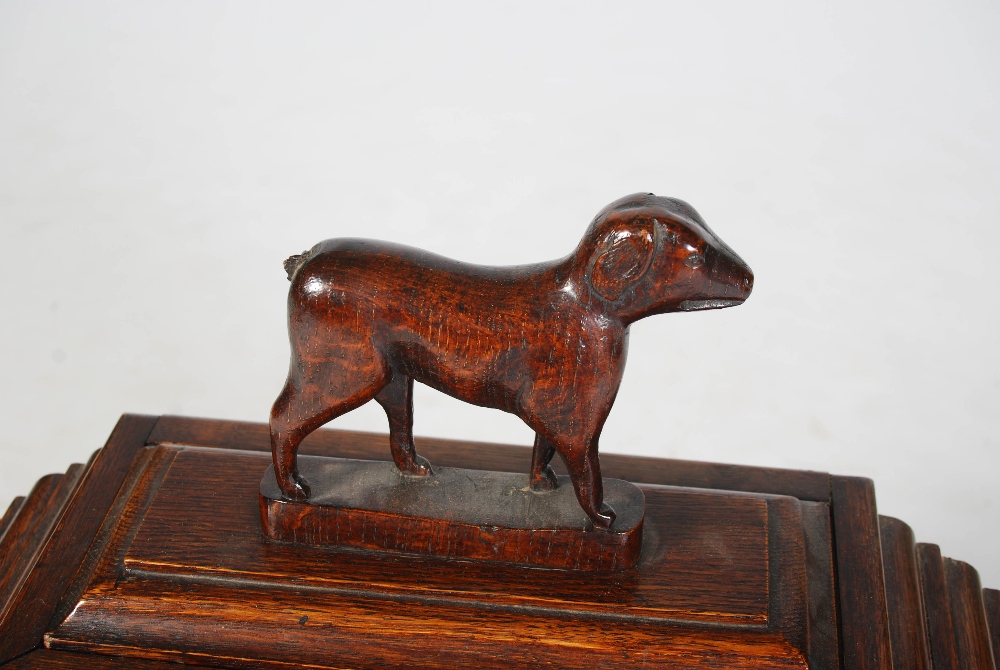 A 19th century oak table cabinet, the caddy top with detachable cover and dog carved finial, over an - Image 3 of 6