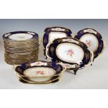 An early 20th century Coalport cobalt blue ground fruit set, comprising; eighteen side plates, two