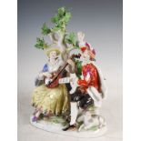 A Meissen porcelain figure group, modelled with musicians sitting before an oak tree, blue crossed