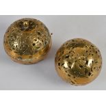 A pair of 18th/ 19th century pierced brass hand warmers/ incense balls, one with original gimbal