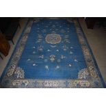 A large Chinese blue ground carpet, early 20th century, the rectangular field centred with a