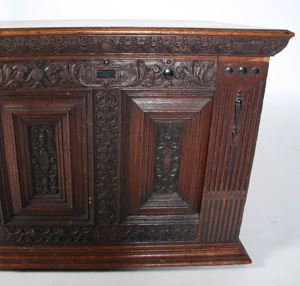 A 19th century Continental oak and ebony inlaid baroque style coffer, the hinged rectangular top - Image 4 of 6