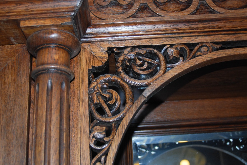 A late 19th century oak sideboard, the upright back with two bevelled mirror recesses and two - Image 7 of 8