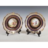 A pair of Dresden cobalt blue ground cabinet plates, decorated with pairs of figures within