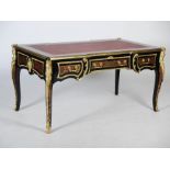A French ebonised and gilt metal mounted boulle work bureau plat, the rectangular top with red