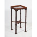 A George III and later mahogany urn stand, the square top with raised gallery, raised on triple