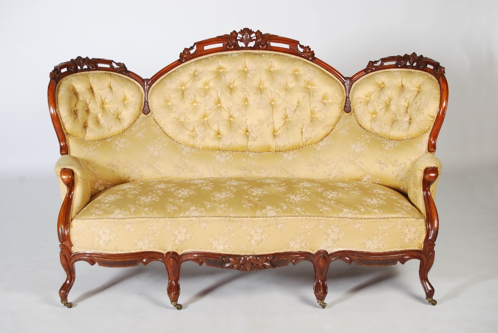 A Victorian mahogany sofa, the top rail carved and pierced with flowers and foliage above a back - Image 2 of 6