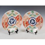 A pair of Japanese Imari chargers, late 19th/early 20th century, the central roundel decorated
