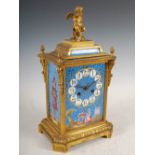 A late 19th century French ormolu and porcelain mounted mantel clock, the circular dial with