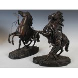 A pair of late 19th/early 20th century bronze Marley horse figures after Guillaume Coustou, 39cm