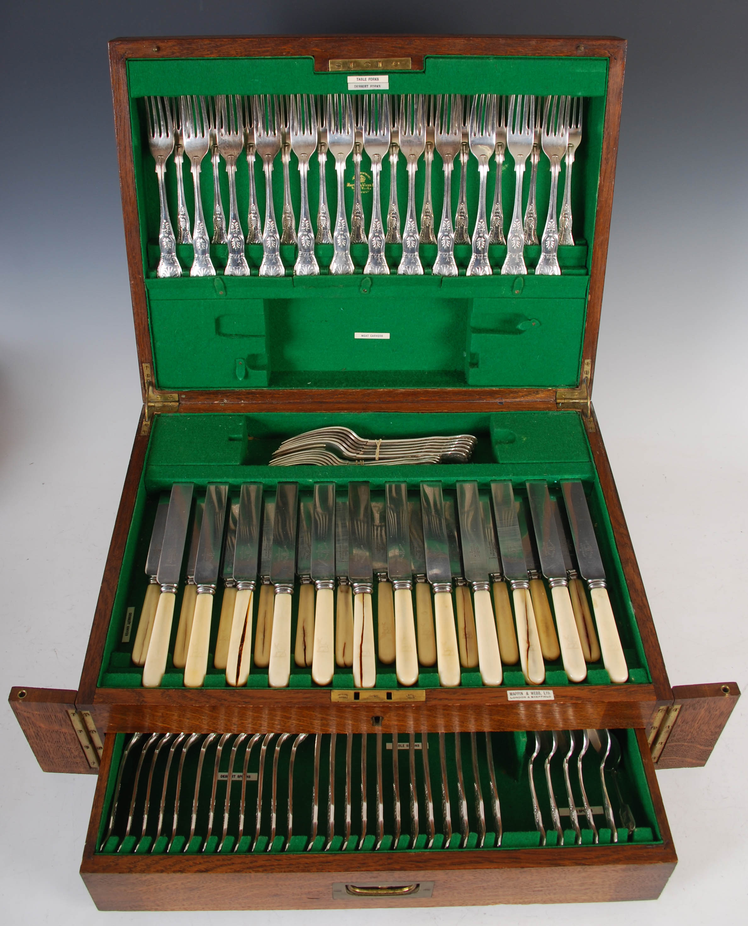 An early 20th century oak cased twelve place canteen of Kings pattern silver flatware and cutlery,