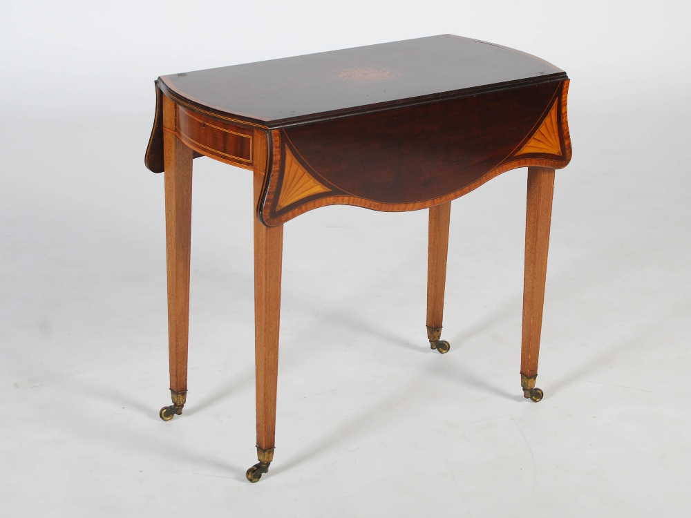 An Edwardian mahogany and satinwood banded Pembroke table in the George III style, the shaped top