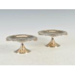 A pair of Tiffany & Co. Sterling Silver tazza, the shaped circular tops with chased and pierced