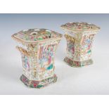 A pair of Chinese porcelain famille rose Canton twin handled bough pots and covers, Qing Dynasty,