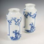 A pair of Japanese porcelain blue and white vases, Meiji Period, decorated with vacant cartouche