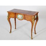 A late 19th century kingwood, rosewood banded and ormolu mounted writing table, the shaped