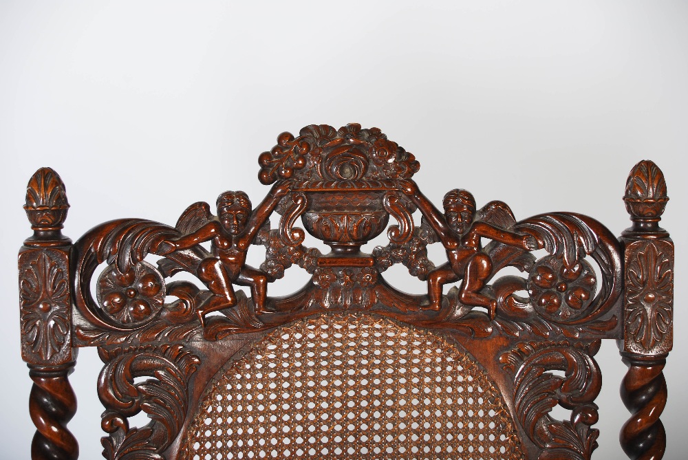 A pair of late 19th century Carolean style carved walnut armchairs, the top rails carved and pierced - Image 4 of 6