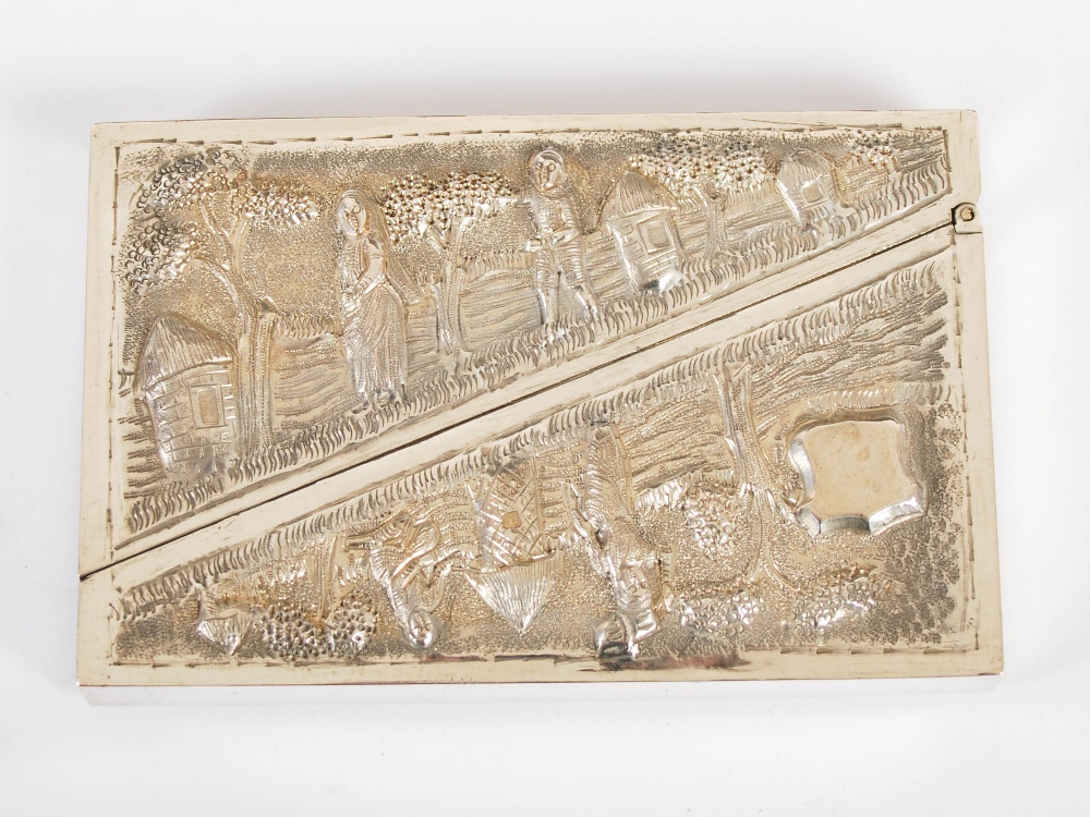 A late 19th century Indian silver card case, embossed with figures, trees and huts, with vacant - Image 2 of 3