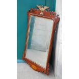 A late 19th/early 20th century mahogany and parcel gilt George II style fret cut wall mirror, the