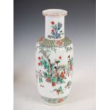 A Chinese porcelain famille verte rouleau vase, Qing Dynasty, decorated with figures in a fenced