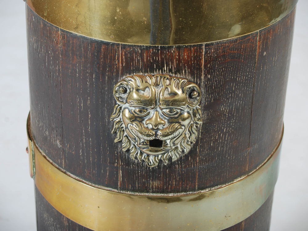 A 19th century oak and brass bound barrel shaped stick stand, with lion mask terminals and four - Image 2 of 2