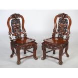 A pair of Chinese dark wood side chairs of Portuguese influence, Qing Dynasty, the shaped and scroll