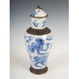 A Chinese porcelain crackle glazed blue and white jar and cover, decorated with shi shi and cubs